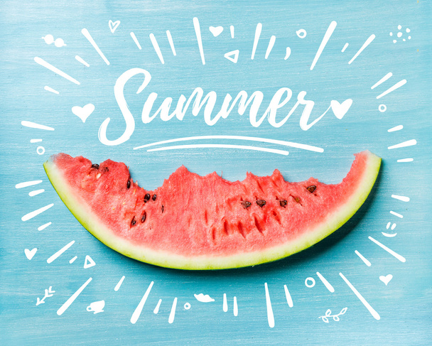 Slice of watermelon on turquoise blue background - Foto, afbeelding