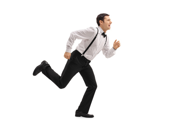 Well-dressed man running - Фото, зображення