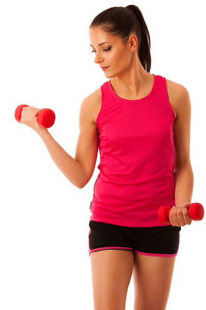 Active young woman workout with dumbbells in fitness gym isolate - Foto, Imagem