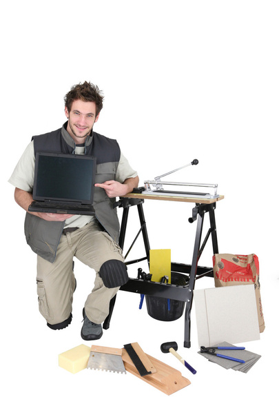 Man with tiles and laptop - Φωτογραφία, εικόνα