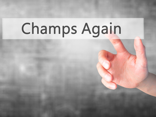 Champs Again - Hand pressing a button on blurred background conc - Photo, Image