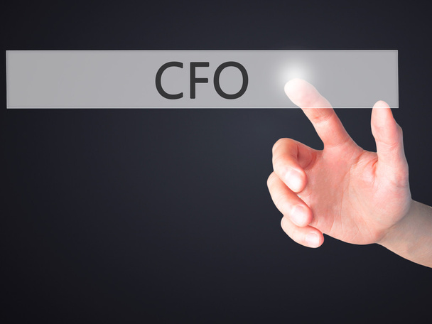 CFO (Director Financiero) - Mano presionando un botón en borroso
 - Foto, imagen