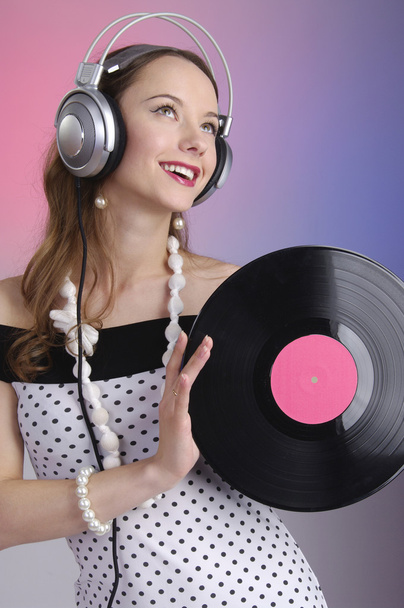 Girl listening music smiling - Foto, afbeelding