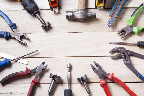 Construction tools on wooden background. Copy space for text. Set of assorted work tools. Top view - Photo, Image