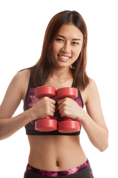 Beautiful Asian healthy girl exercise with dumbbell. - Foto, Bild