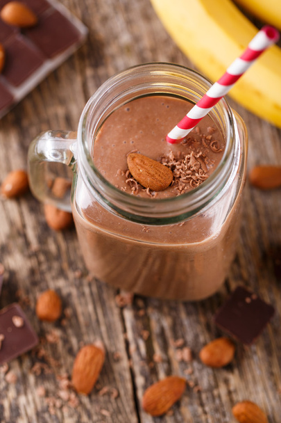 Detox chocolate smoothie with nuts in glass jar. - Photo, Image