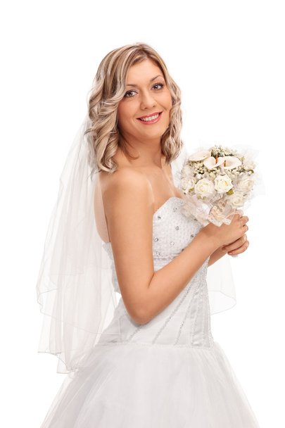 Beautiful bride holding a wedding flowers  - Φωτογραφία, εικόνα