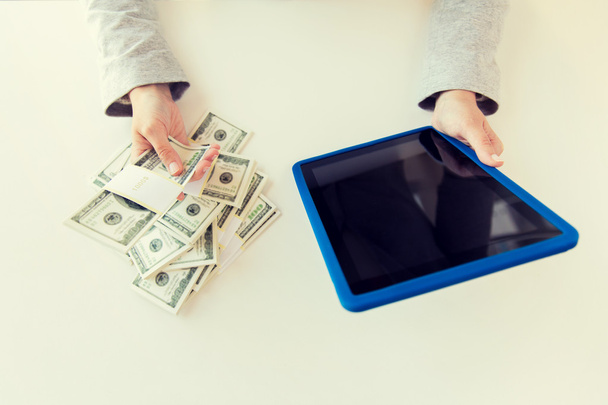 close up of woman hands with tablet pc and money - Φωτογραφία, εικόνα