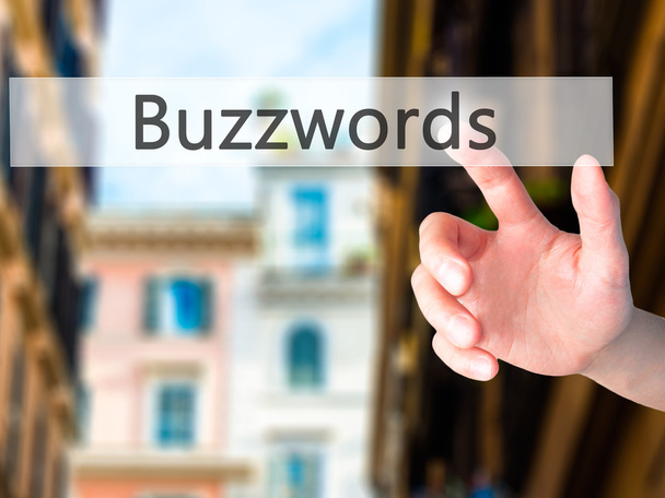 Buzzwords - Mano presionando un botón en el concepto de fondo borroso
 - Foto, imagen
