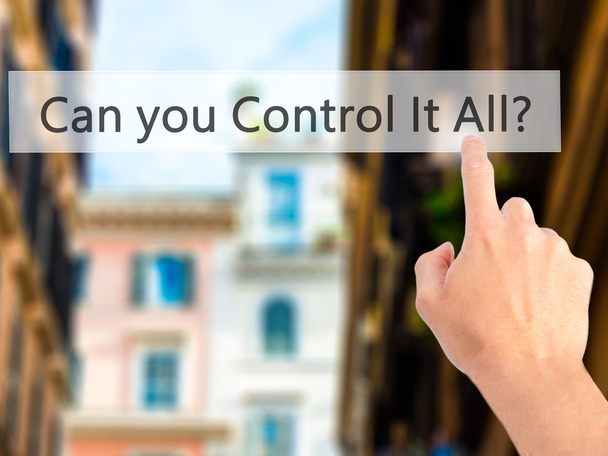 Can you Control It All ? - Hand pressing a button on blurred bac - Photo, Image