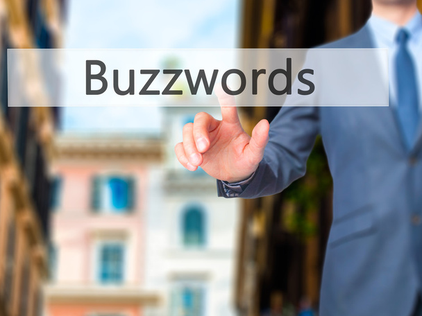 Buzzwords - biznesmen kliknij na wirtualny ekran dotykowy. - Zdjęcie, obraz