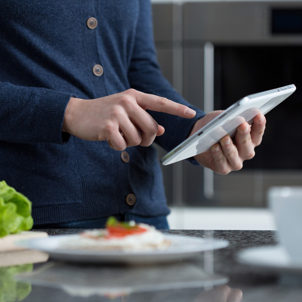 Searching for recipe on the tablet - Photo, image