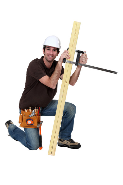 A carpenter with a plank. - Foto, Imagem