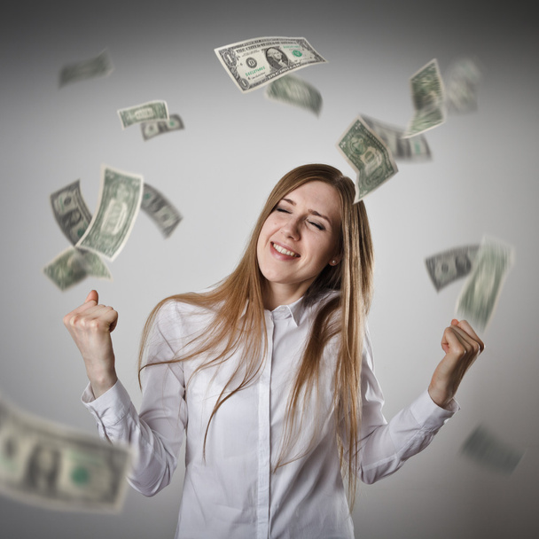 Rejoicing. Woman in white and dollars. - Fotoğraf, Görsel