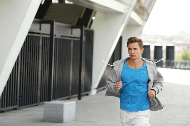 Young man running  - Φωτογραφία, εικόνα