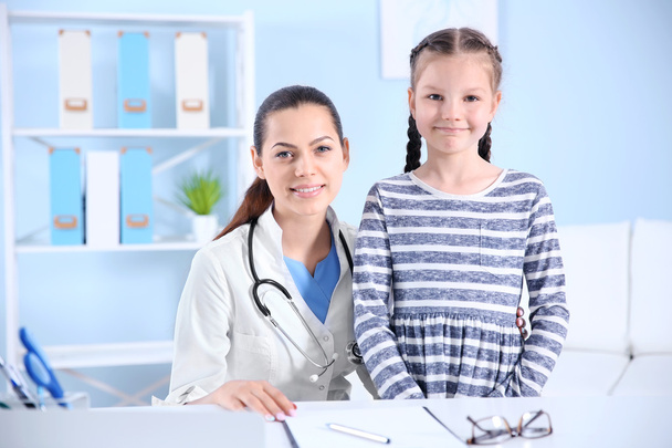 Cute girl visiting a doctor - Photo, image
