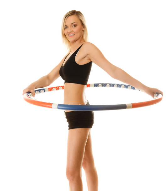 sporty fit girl doing exercise with hula hoop. - Foto, Imagen