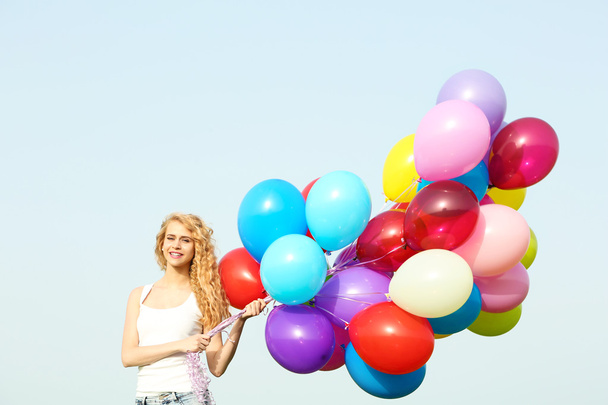 woman with colorful balloons - Фото, изображение