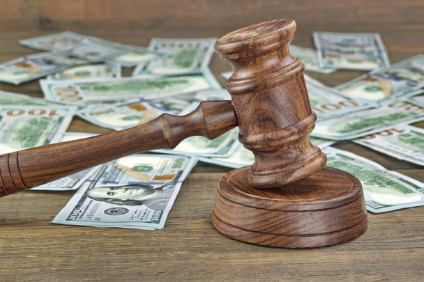 Financial Crime or Fraud or Auction Concept Image With Judges Gavel or Auction Hammer And Money Stack On The Background, Close Up - Photo, Image