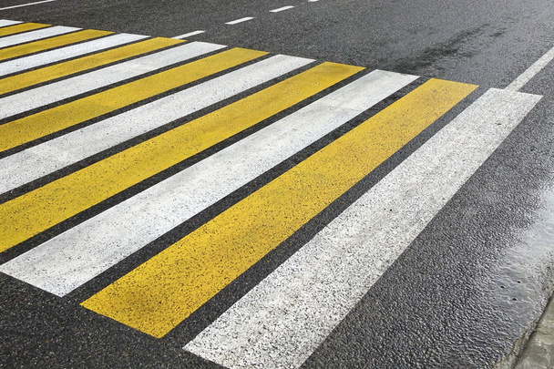 White Yellow Zebra Pedestrian Crossing On The Wet Asphalt Road - Photo, Image