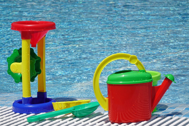 Group Of Beach Plastic Colorful Child Toys At The Poolside - Photo, Image