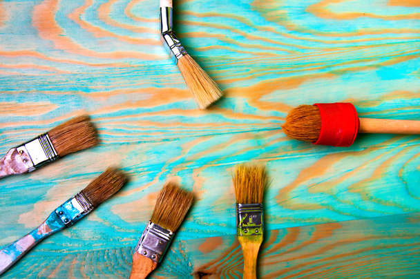 Painting brushes on blue wooden table - Photo, Image