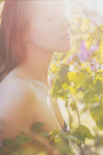Adorable Gentle feminine girl among the blooming garden - Photo, Image