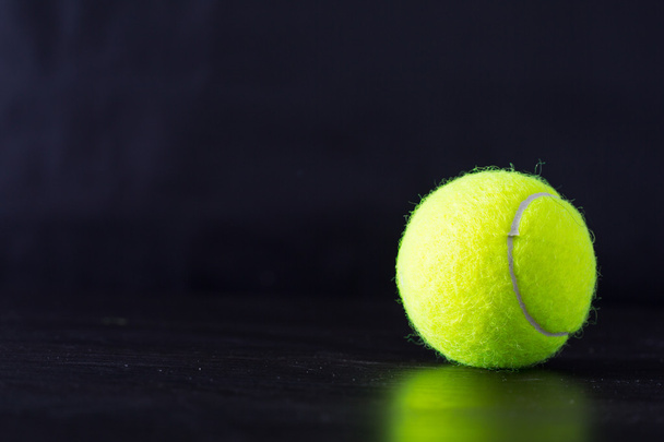 Tennis ball black with background. - Photo, image