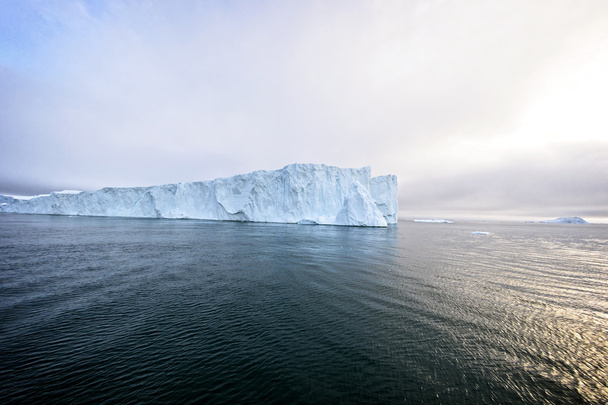 huge glaciers are on the arctic ocean to Ilulissat icefjord, Greenland - Photo, Image