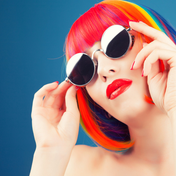 beautiful woman wearing colorful wig - Foto, Bild