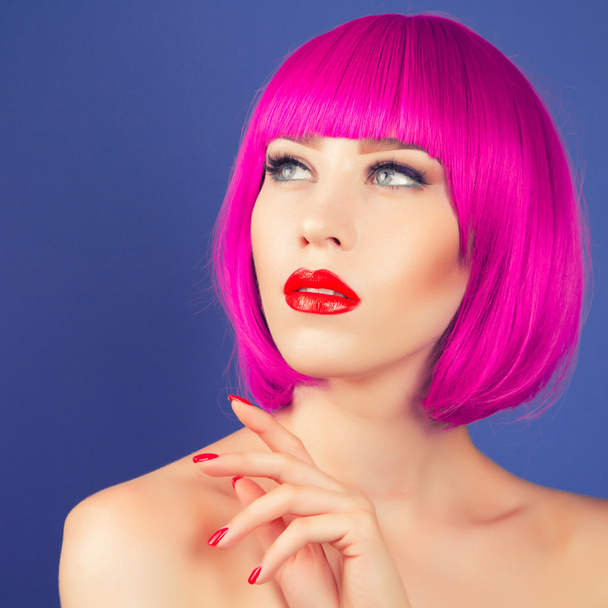 beautiful woman wearing colorful wig - Foto, Imagen