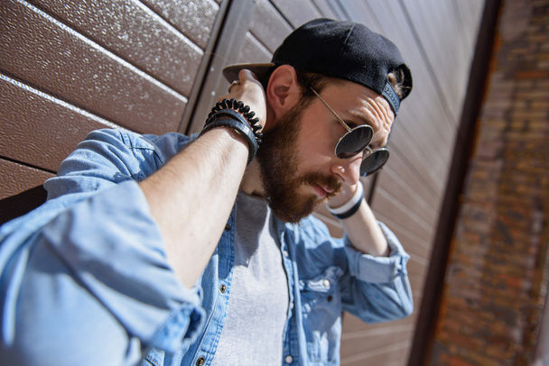 Serious hipster with hat and glasses - Фото, изображение