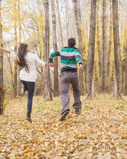 Portrait of Young adult  latin hispanic couple holding hands and running  - Fotoğraf, Görsel