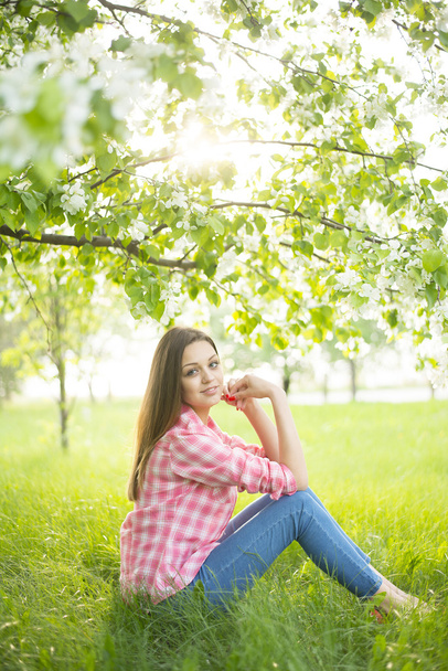  girl sitting down under tree - Photo, image