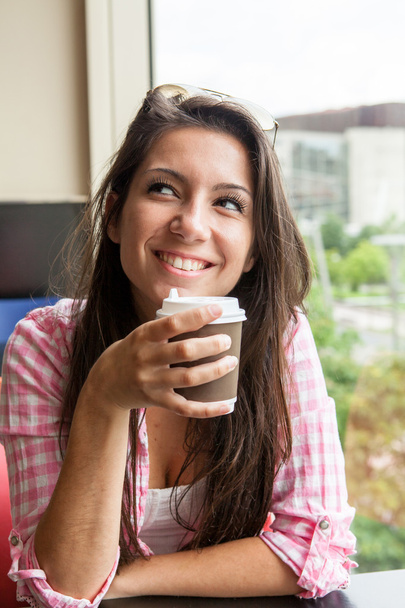 Young girl with a warm drink - Photo, Image