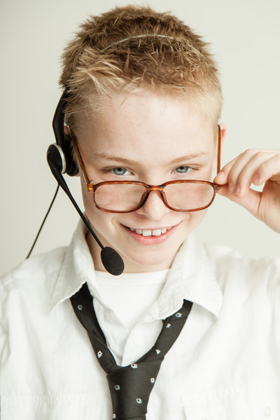 Smiling Boy Dressed as Businessman with Head Set - Photo, Image