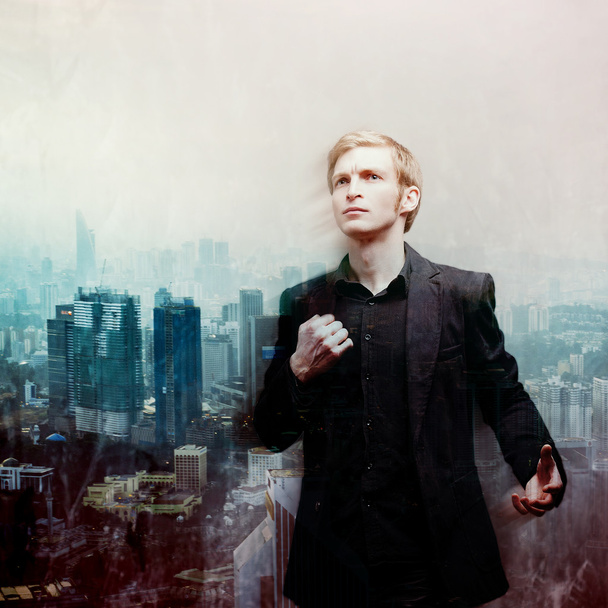 ambitious young man on background of megalopolis, double exposure - Фото, зображення