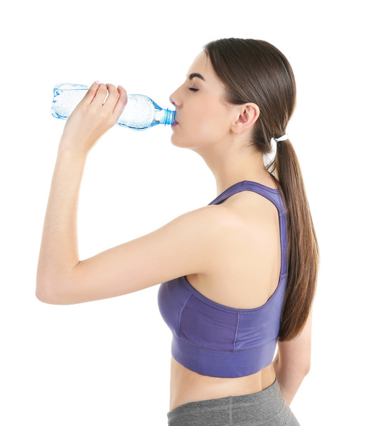 Young woman drinking water - Photo, Image