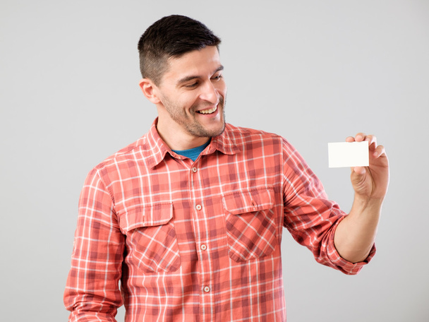 Man showing blank business card - Фото, изображение