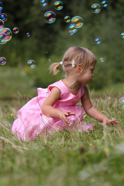 Little girl with soap bubbles - Photo, Image