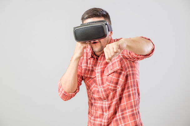 Man in fighter stand with virtual reality glasses - Photo, Image