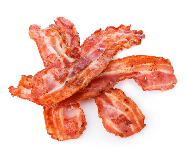 Cooked bacon rashers close-up isolated on a white background. - Photo, Image