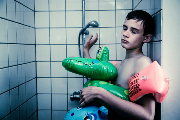 Teenage Boy Wearing Float Toys in Shower - Photo, Image