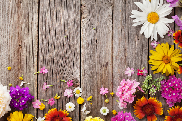 Garden flowers over wooden table - Fotografie, Obrázek
