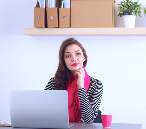 Young pretty business woman with notebook in the office - Foto, Imagem