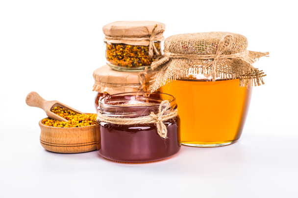 Still life with honey, honeycomb, pollen and propolis on a white - Zdjęcie, obraz