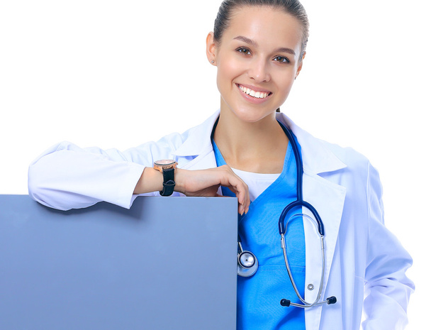 A female doctor with a blank billboard. - Фото, изображение