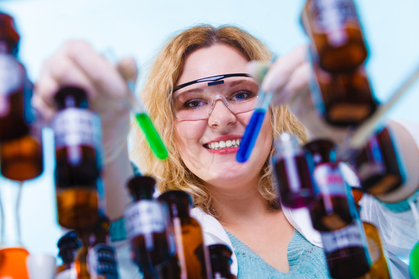 female chemistry student with glassware test flask. - Φωτογραφία, εικόνα