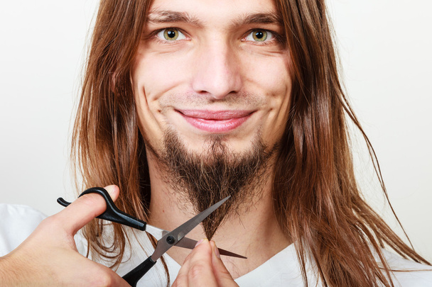 Man cutting his beard - Zdjęcie, obraz