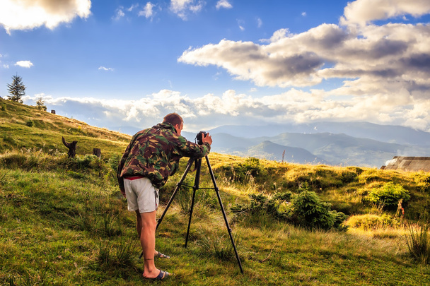 Photographer taking photo of mountain landscape, Carpathian, Ukraine - Photo, Image